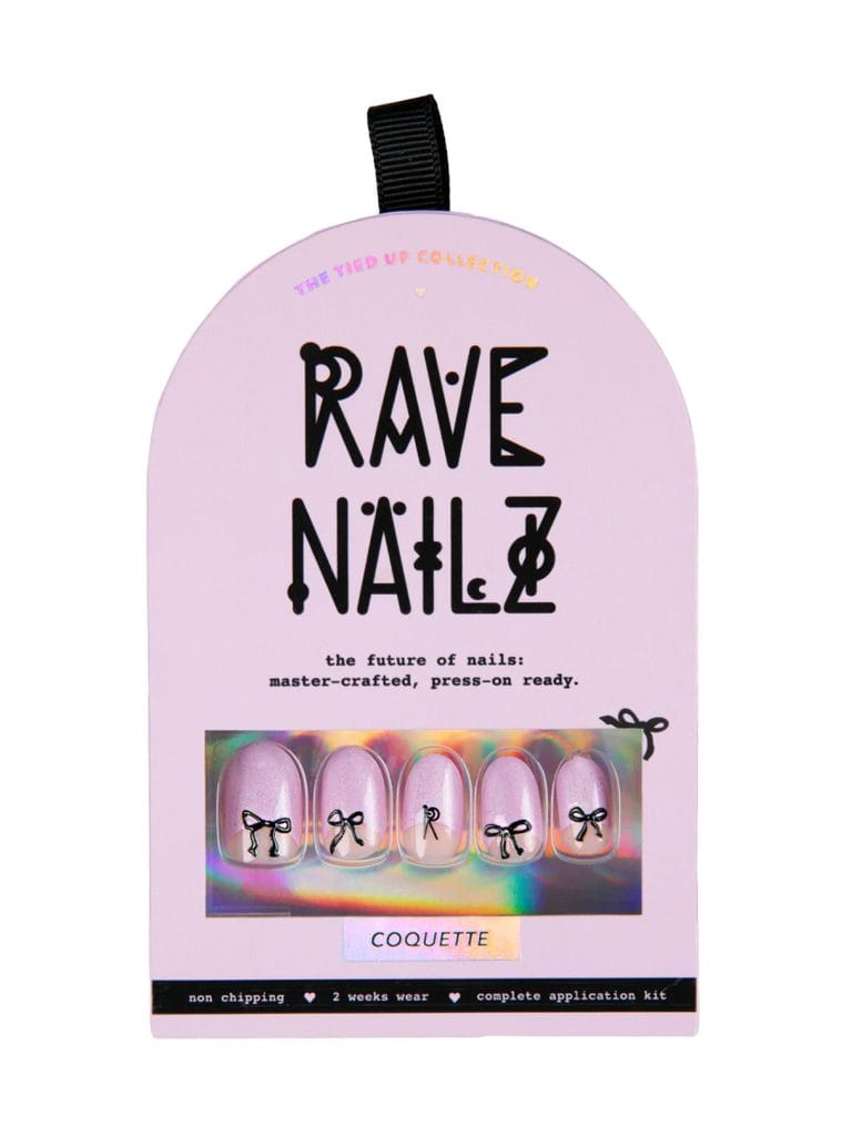 Rave Nailz Coquette press-on nail kit in lilac arched box with five lavender shimmer oval nails each decorated with a small black bow